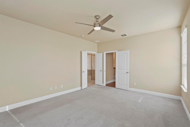 unfurnished bedroom with ceiling fan and light carpet