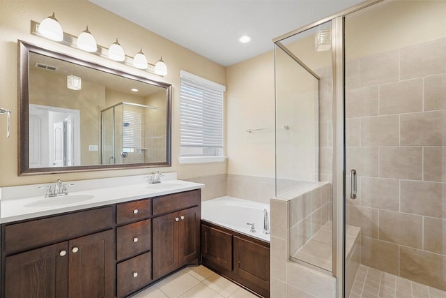 bathroom featuring vanity, tile patterned floors, and separate shower and tub