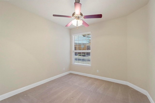 carpeted empty room with ceiling fan