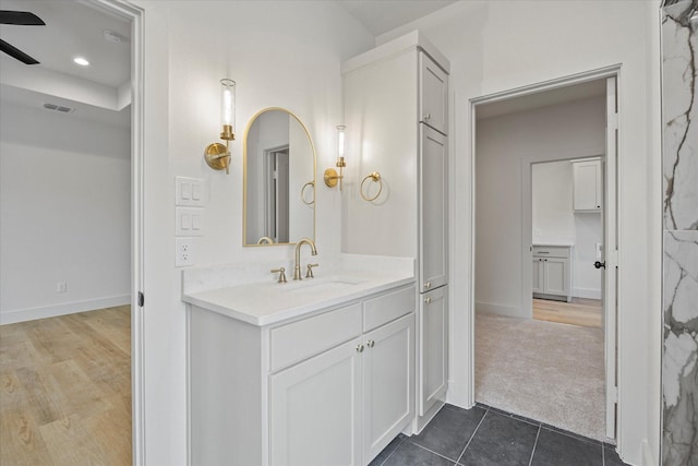 bathroom featuring vanity, tile patterned flooring, and ceiling fan