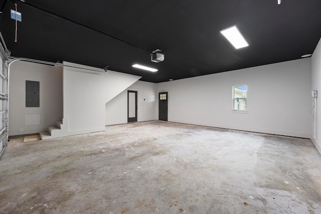 garage featuring a garage door opener and electric panel