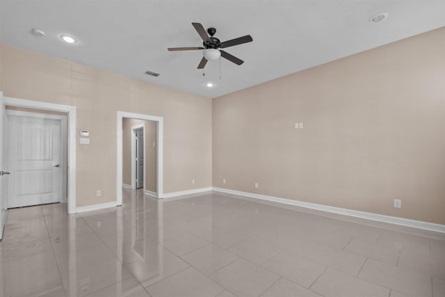 empty room featuring light tile patterned floors, recessed lighting, visible vents, ceiling fan, and baseboards