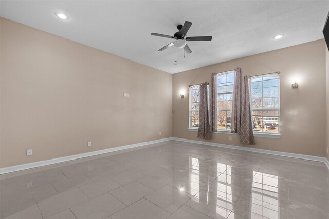 tiled empty room featuring baseboards, recessed lighting, and ceiling fan