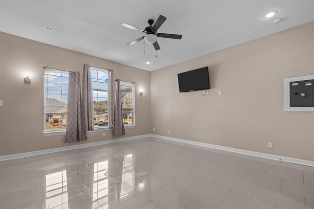 tiled spare room featuring recessed lighting, baseboards, and ceiling fan