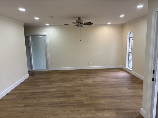 empty room featuring crown molding, ceiling fan, and dark hardwood / wood-style floors