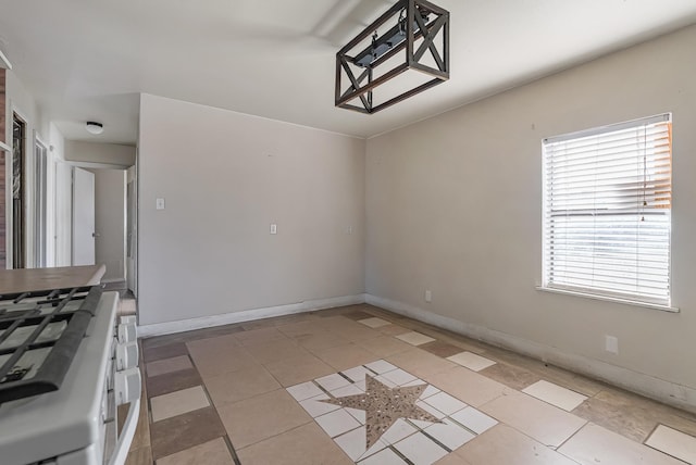 unfurnished dining area with light tile patterned floors and a wealth of natural light