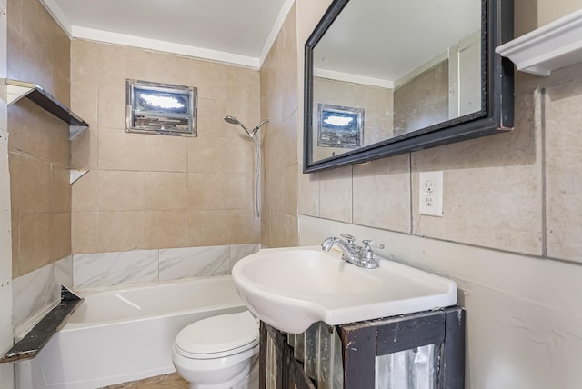 full bathroom with tiled shower / bath combo, tasteful backsplash, sink, and toilet