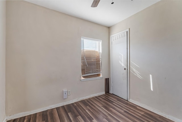 unfurnished room featuring ceiling fan and dark hardwood / wood-style floors