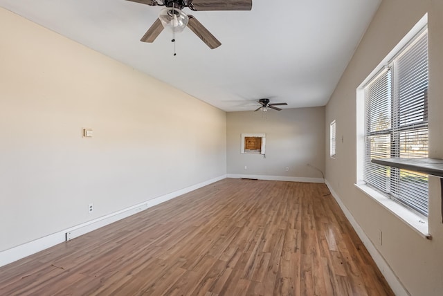 unfurnished room featuring ceiling fan and wood-type flooring