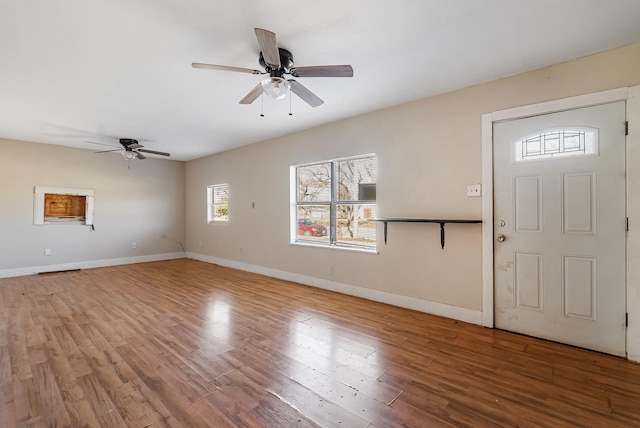 foyer entrance featuring hardwood / wood-style floors and ceiling fan