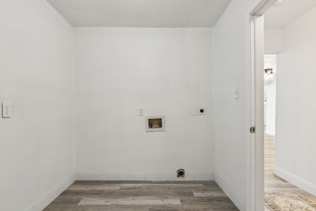 washroom with light hardwood / wood-style floors, hookup for a washing machine, and electric dryer hookup