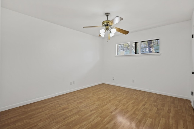 empty room featuring ceiling fan and light wood-type flooring