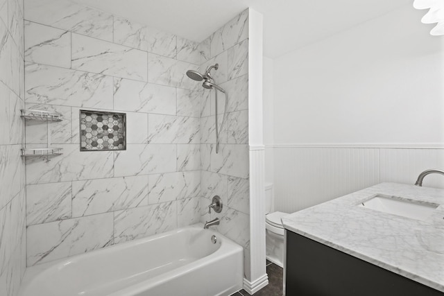 full bathroom featuring vanity, toilet, and tiled shower / bath combo