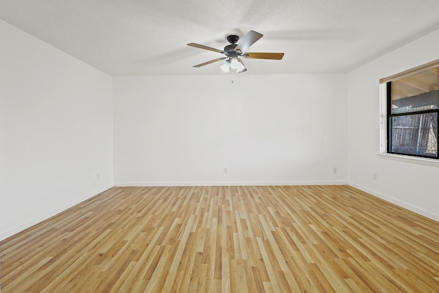 unfurnished room with ceiling fan, a textured ceiling, and light hardwood / wood-style flooring