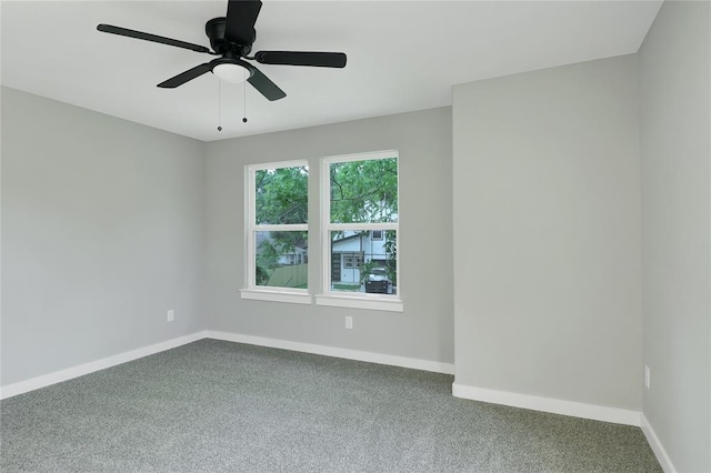 empty room with carpet flooring and ceiling fan