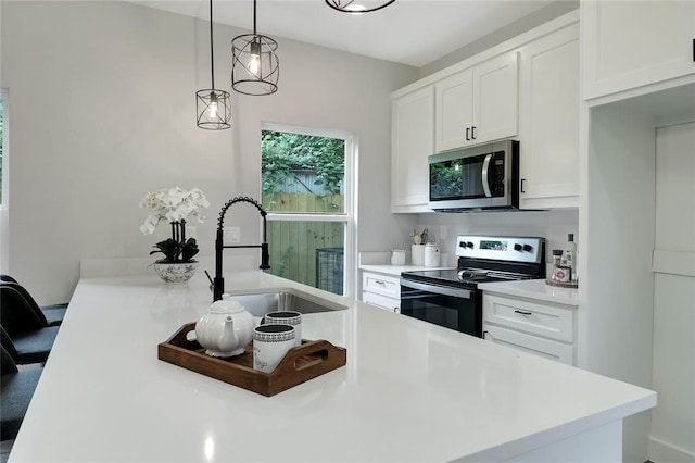 kitchen with white cabinetry, sink, electric range oven, and pendant lighting