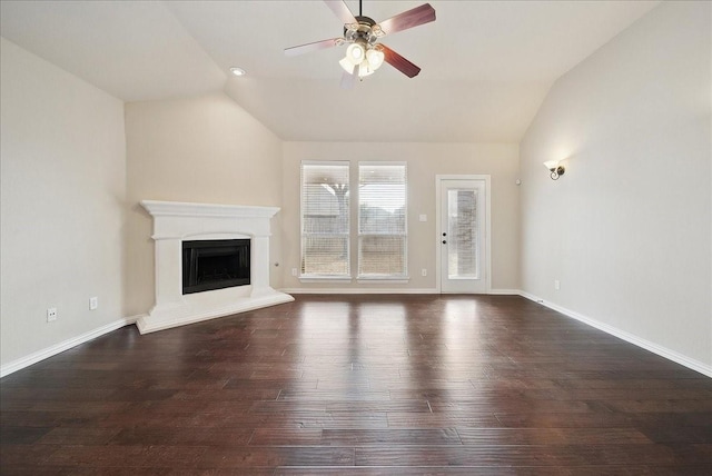 unfurnished living room with ceiling fan, dark hardwood / wood-style flooring, and vaulted ceiling