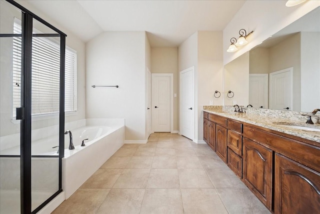 bathroom featuring lofted ceiling, vanity, plus walk in shower, and tile patterned flooring