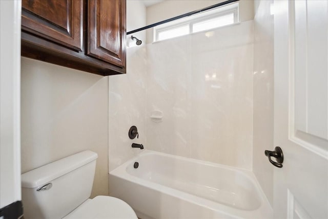 bathroom featuring shower / tub combination and toilet