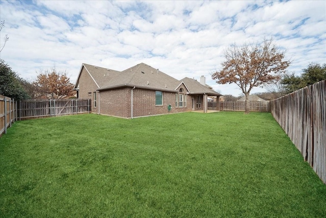 view of yard with a fenced backyard