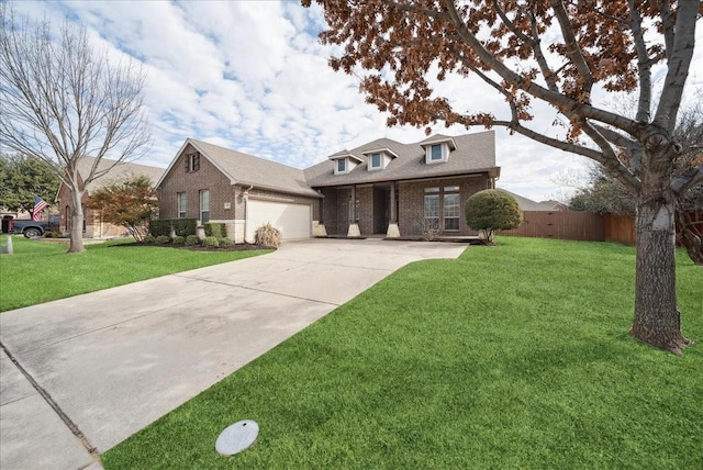 view of front of house featuring brick siding, concrete driveway, an attached garage, a front yard, and fence