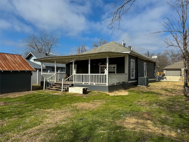 rear view of property featuring a yard, central air condition unit, and a porch