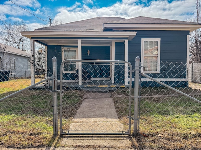 bungalow featuring covered porch and a front lawn