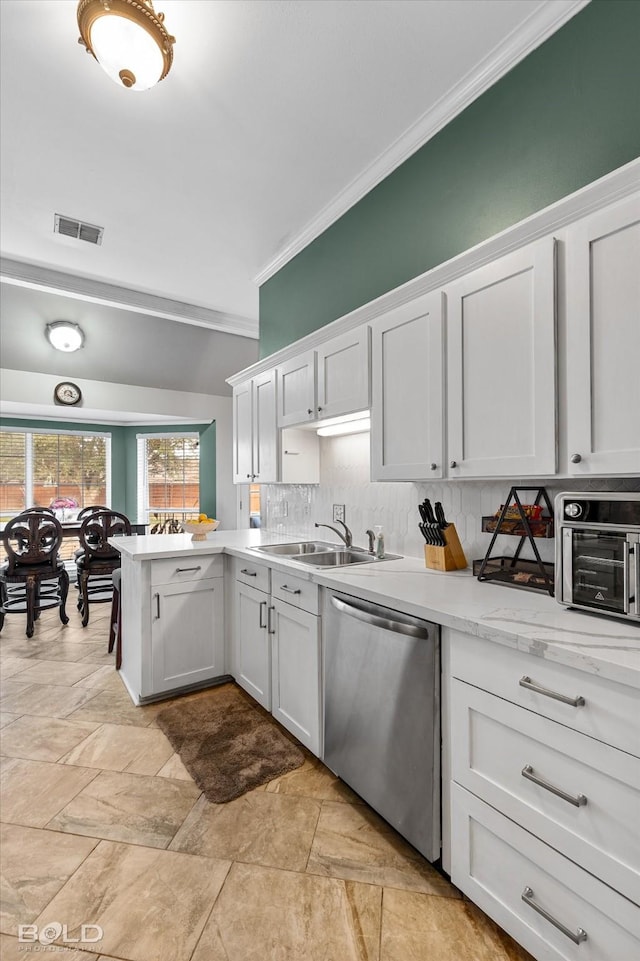 kitchen featuring crown molding, sink, stainless steel dishwasher, and white cabinets