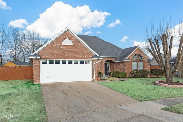 view of front of property with a garage and a front lawn