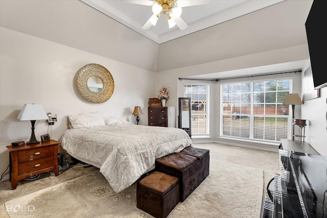 bedroom featuring carpet, lofted ceiling, and ceiling fan