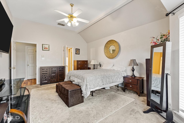 carpeted bedroom featuring ceiling fan and lofted ceiling