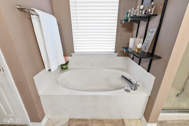 bathroom featuring separate shower and tub