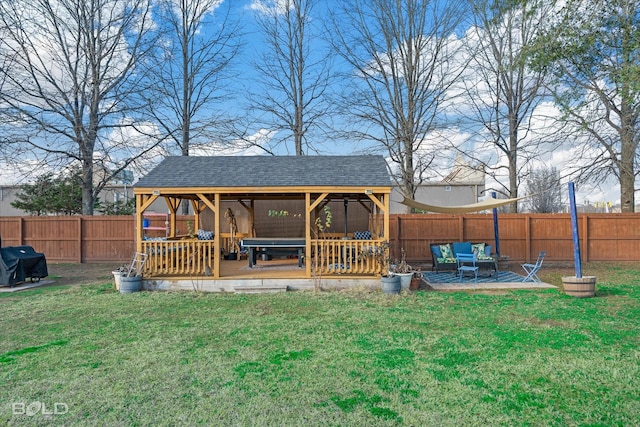 back of house featuring a yard and a deck