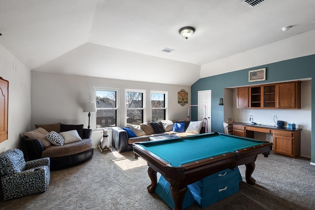 rec room with billiards, built in desk, vaulted ceiling, and light colored carpet