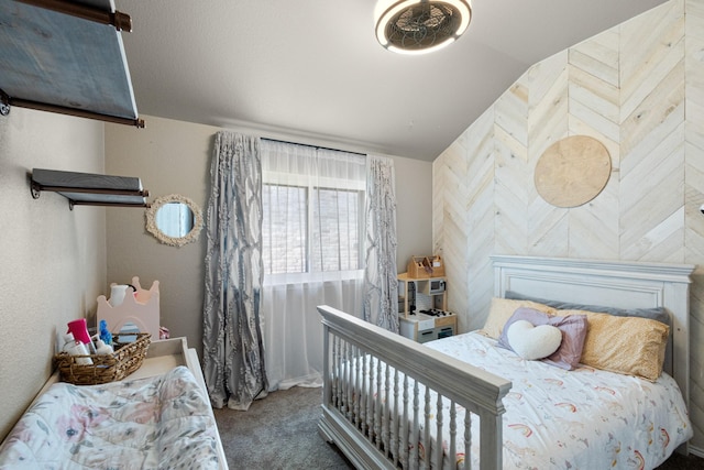 bedroom with vaulted ceiling and carpet floors