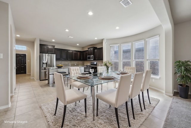 dining area with light tile patterned flooring