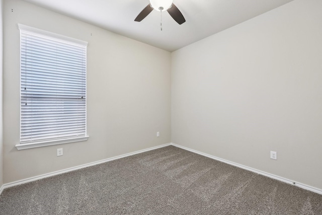 empty room with baseboards, a ceiling fan, and carpet flooring