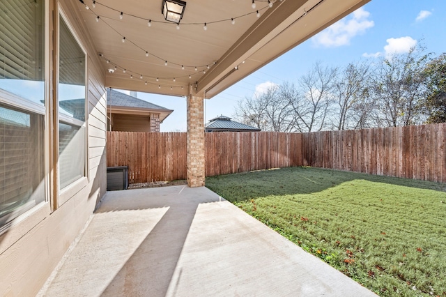 view of yard with a patio area and a fenced backyard