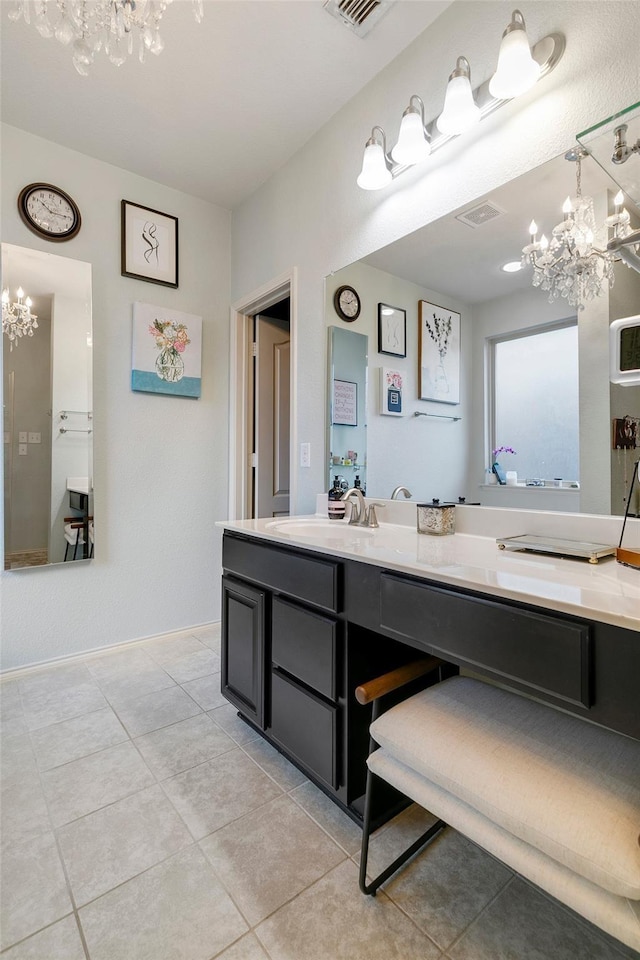 bathroom featuring tile patterned flooring and vanity