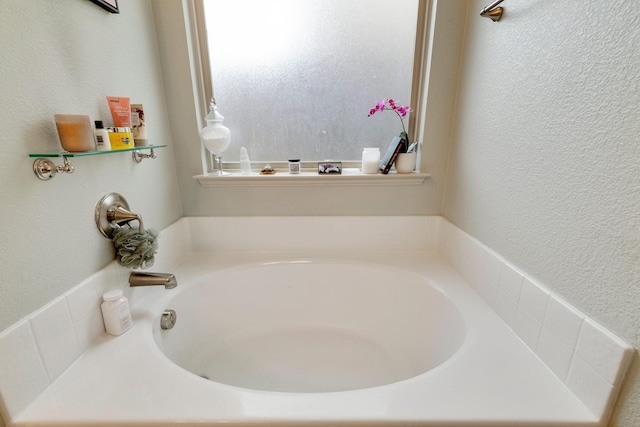 bathroom featuring a tub to relax in