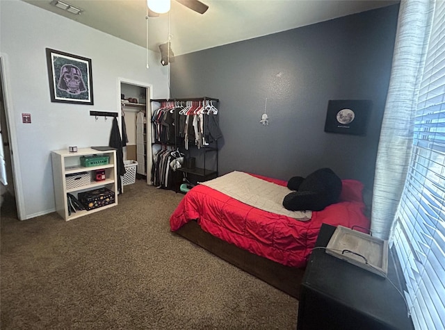 carpeted bedroom with a closet and ceiling fan