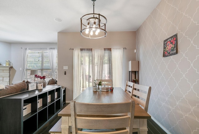 dining space featuring an inviting chandelier and hardwood / wood-style flooring