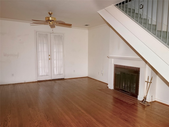 unfurnished living room with crown molding, wood-type flooring, ceiling fan, and a fireplace