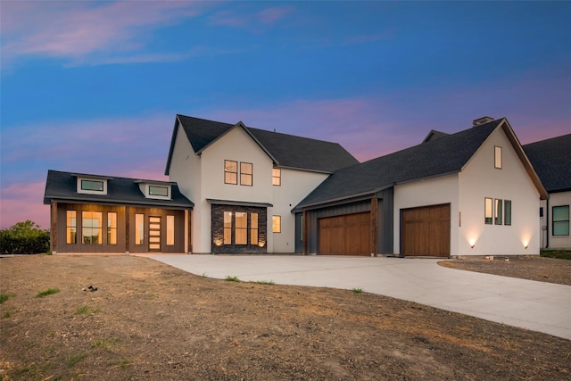 view of front of property with a garage and covered porch