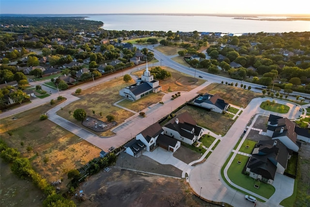 aerial view at dusk with a water view