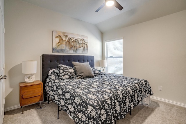 carpeted bedroom featuring lofted ceiling and ceiling fan