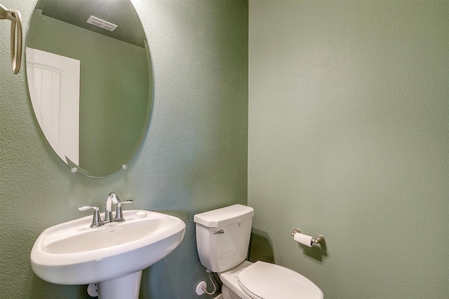 bathroom featuring sink and toilet