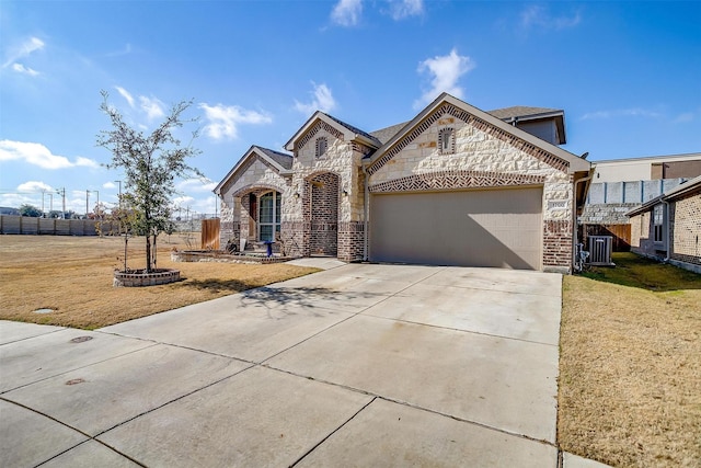 view of front of house featuring a garage and a front yard