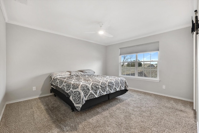 carpeted bedroom with ornamental molding and ceiling fan