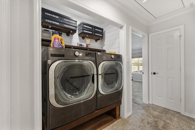 laundry area with crown molding, independent washer and dryer, and carpet flooring